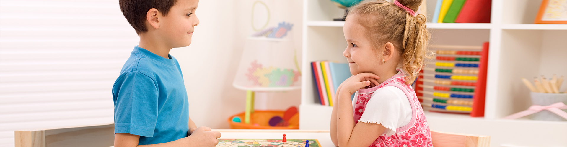 two kids playing board game